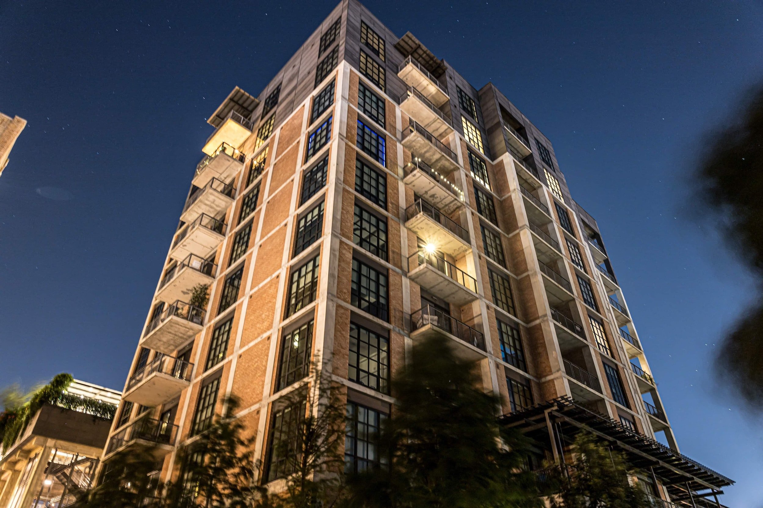 Image of high rise condominium from the street level.